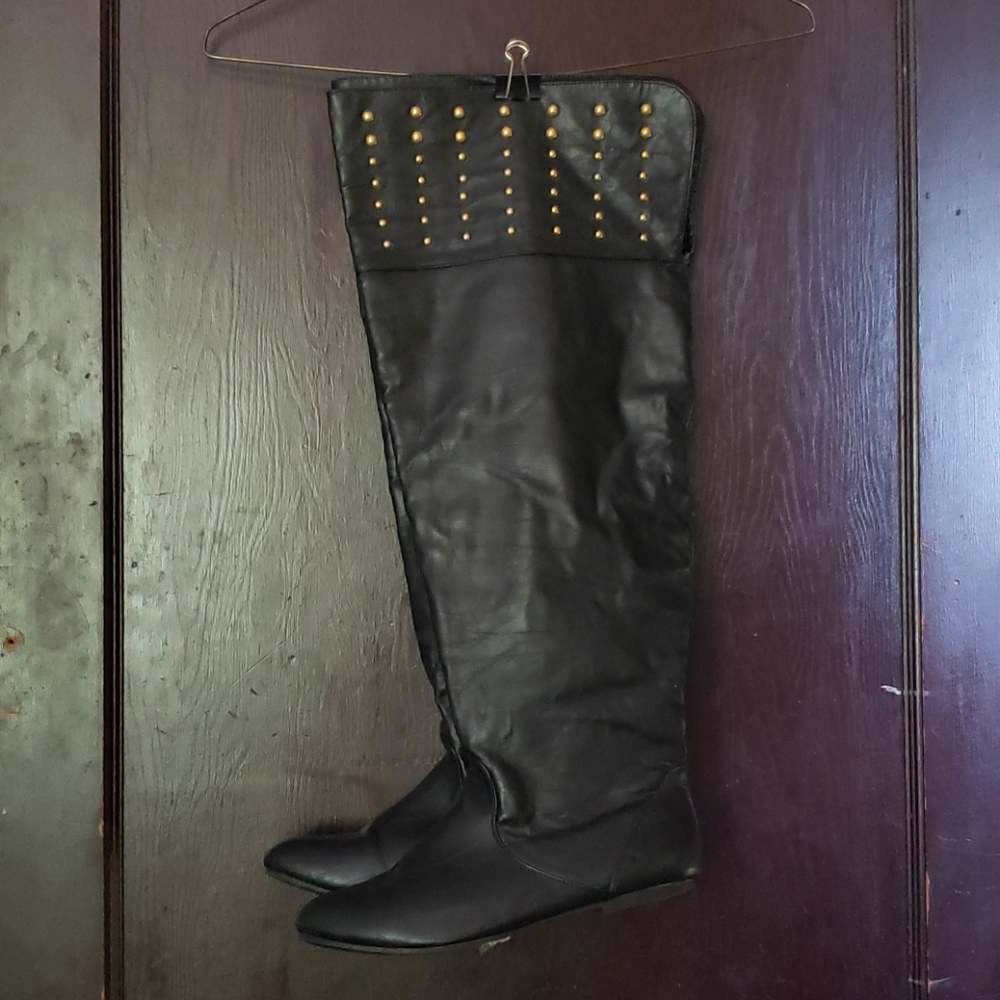 Wide Calf thigh-high black boots.